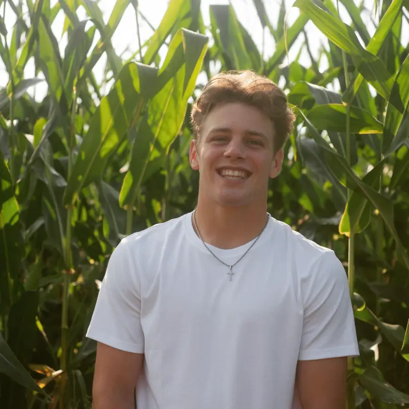 Karson Dobmeier in a corn field