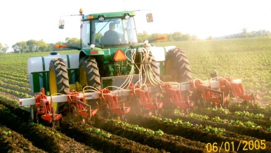 Tractor operating in field during planting season