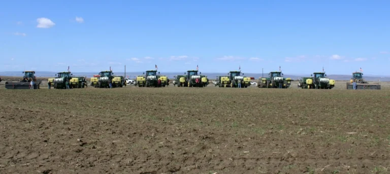 Farm equipment lined up in open field