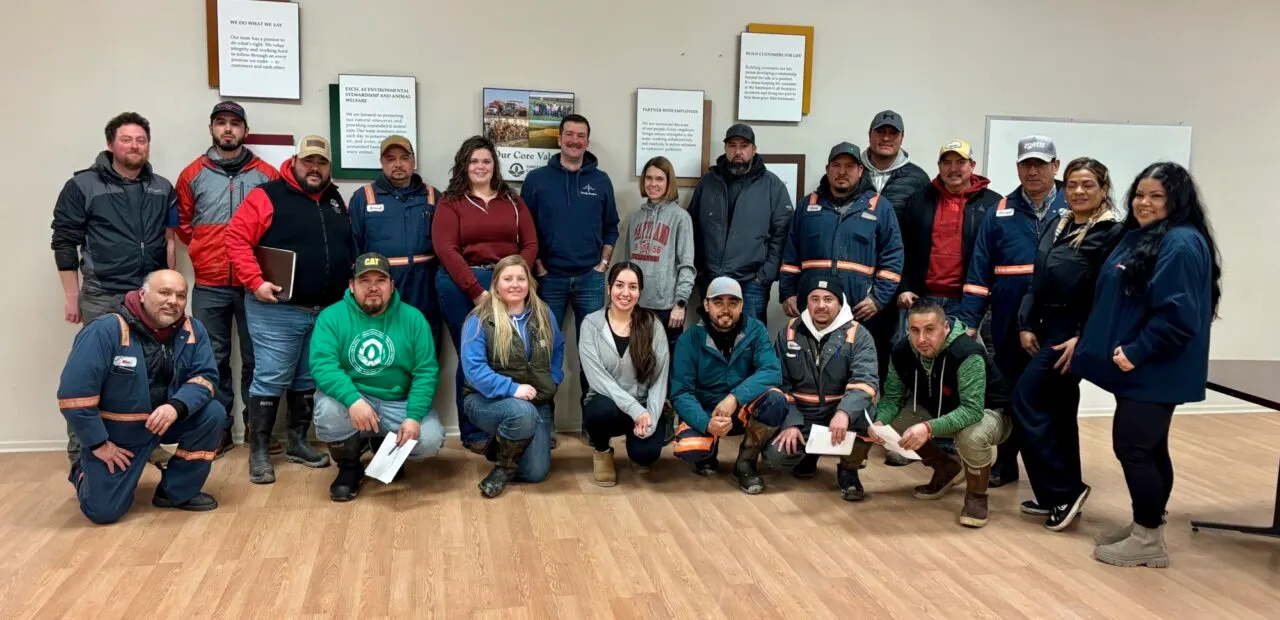 Animal Welfare team posing together indoors for group photo
