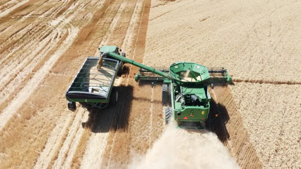 Aerial view of harvesting equipment working in field