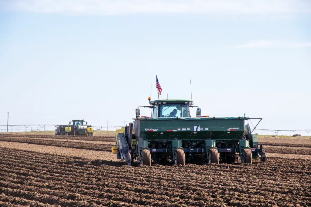Agricultural planting equipment working in field