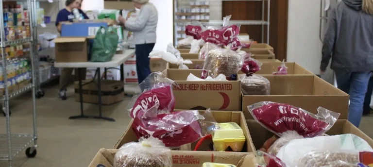 Boxes of packaged food and produce indoors