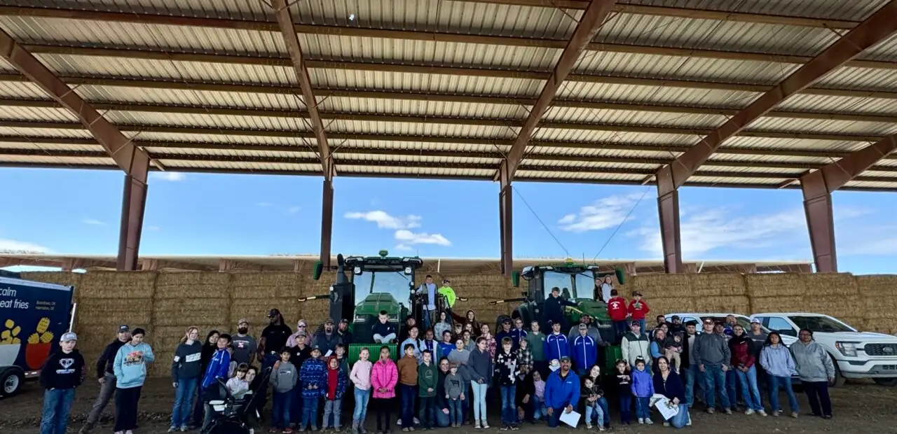 Group photo under open-sided farm structure