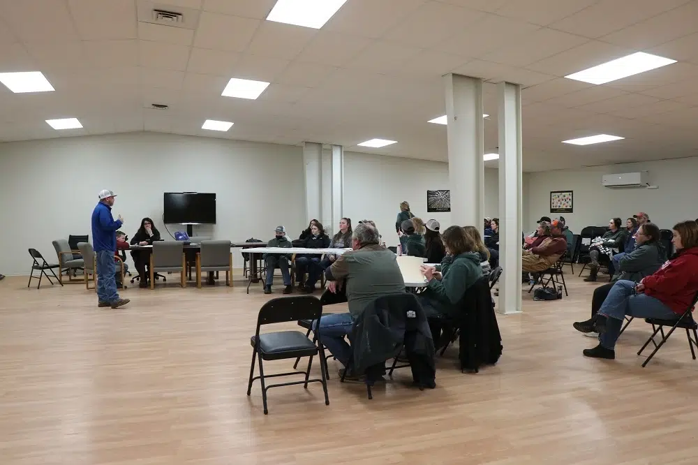 Group seated during indoor meeting