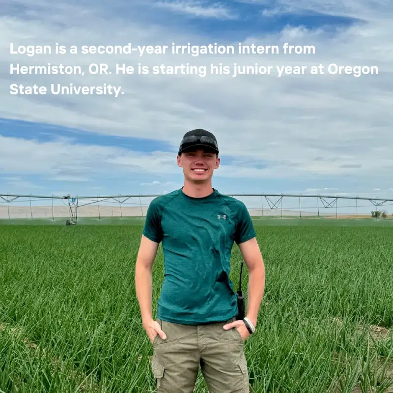 ogan, standing in a grass field with irrigation equipment visible in the background. Transcribed Text: Logan is a second-year irrigation intern from Hermiston, OR. He is starting his junior year at Oregon State University.