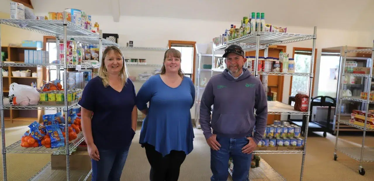 People standing together inside food pantry