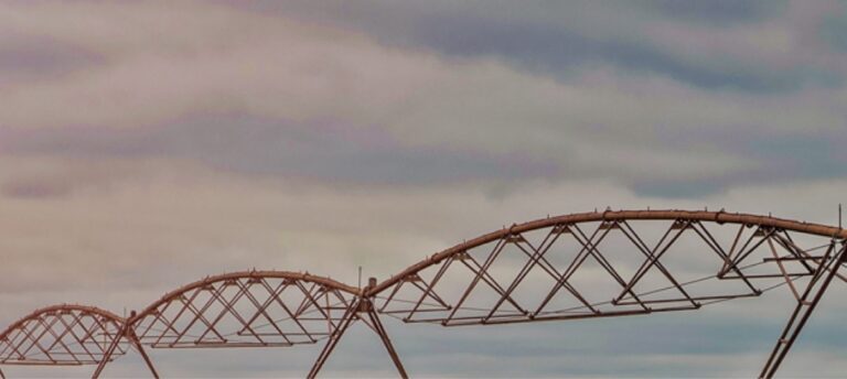 Irrigation structure against cloudy sky