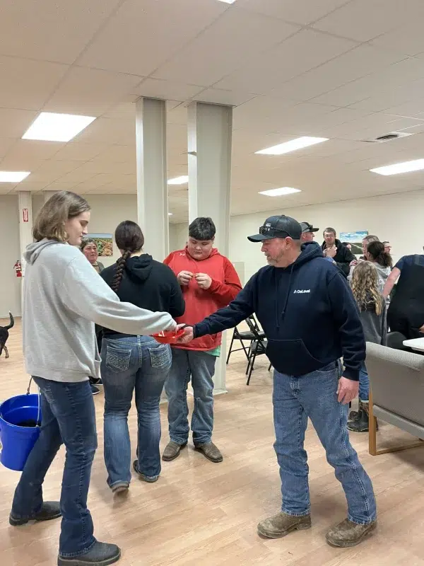 People greeting each other during indoor workshop