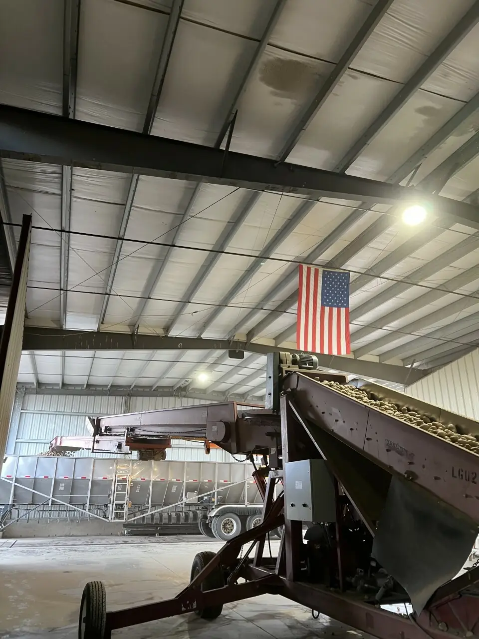 Interior of agricultural facility with American flag